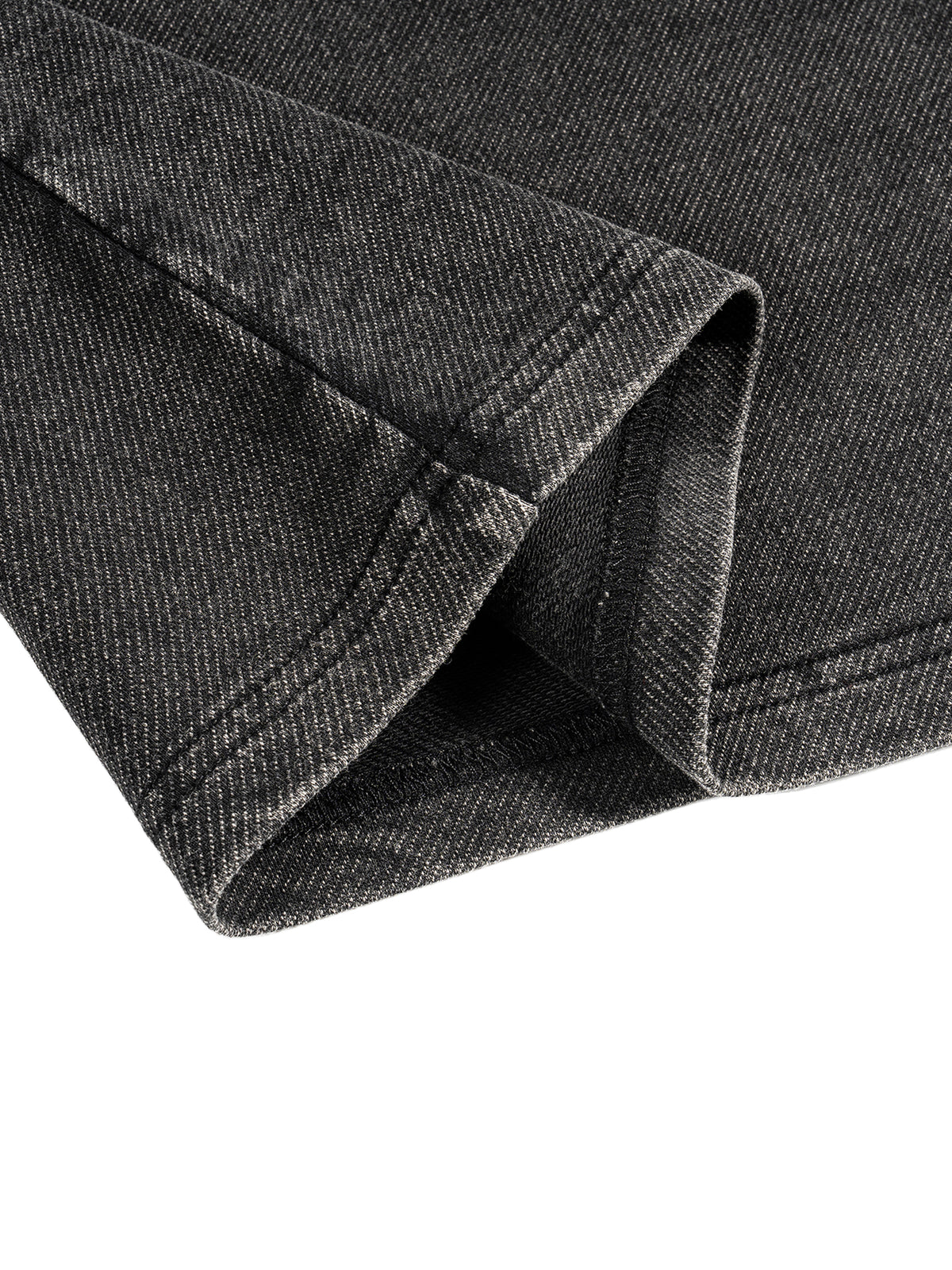 SYNFURY close-up of ash black fabric with a visible texture on a white background