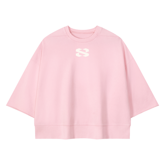 A light pink crewneck sweatshirt with a small white stylized 'S' logo on the center chest, displayed on a clean white background.
