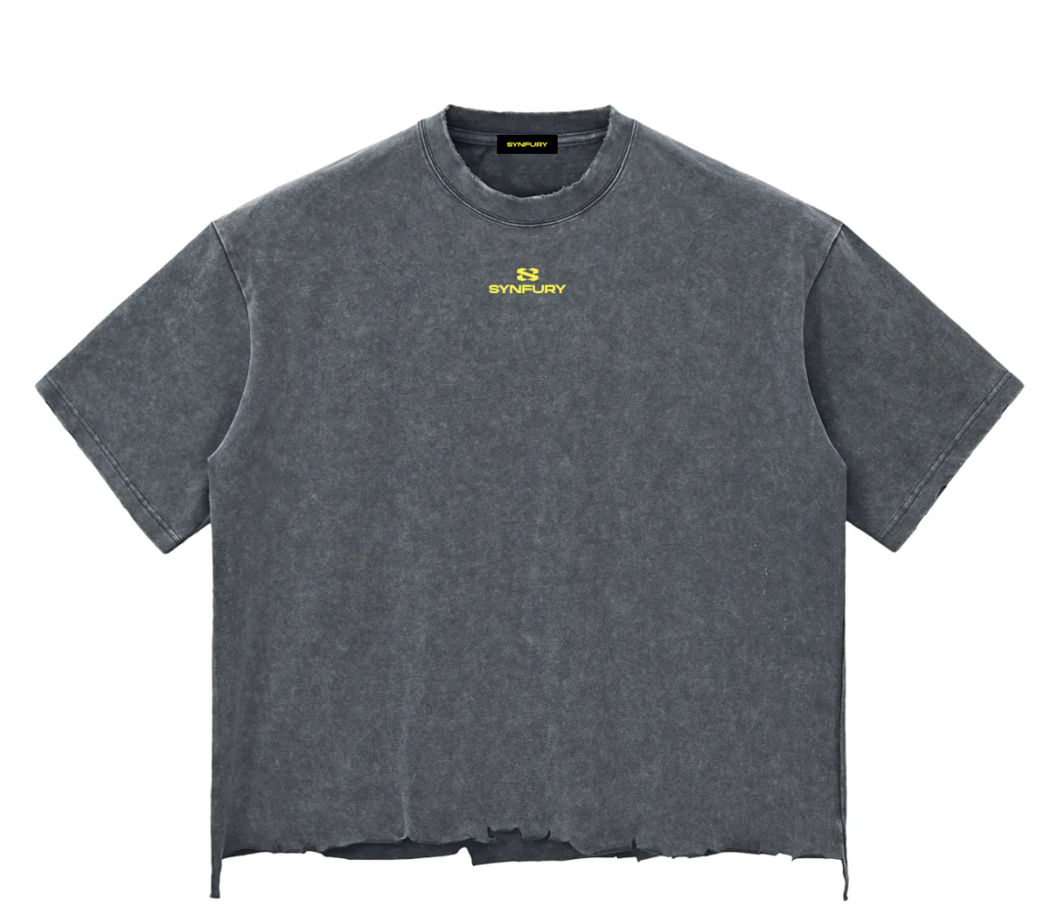 Stone Gray mineral-wash cutoff tee, front view — heavyweight cotton with cap sleeves, raw distressed hem, and center-chest SYNFURY logo, product shot on white background