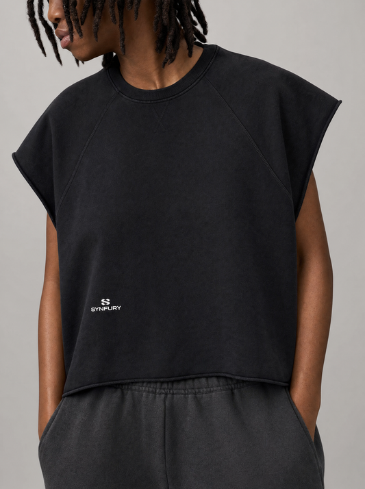 The Legacy Cutoff Tee worn on model — heavyweight cotton, cropped boxy silhouette, raglan short sleeves, center-chest SYNFURY logo
