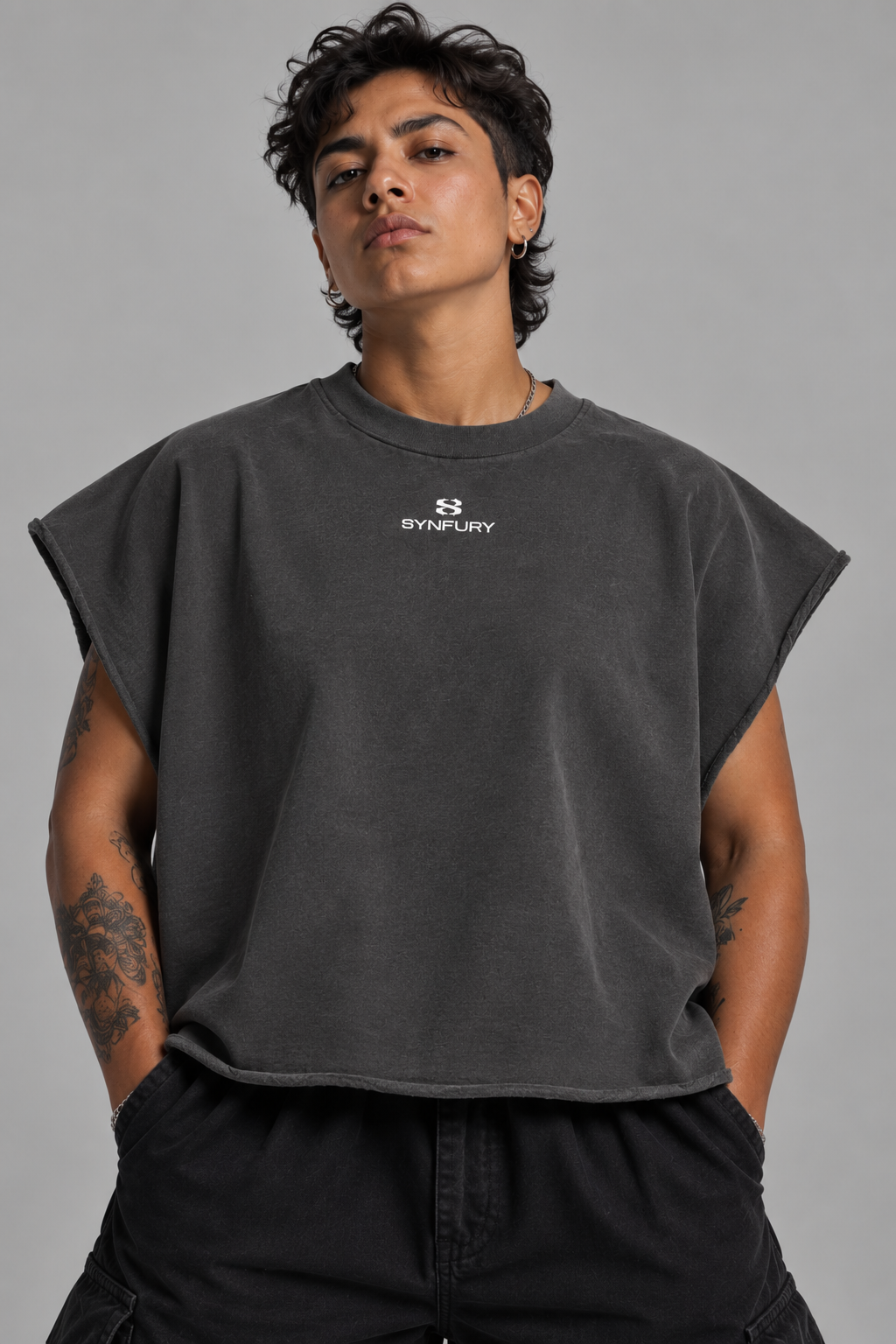 The Outlier cutoff tee with SYNFURY chest logo, oversized fit, paired with cargo pants