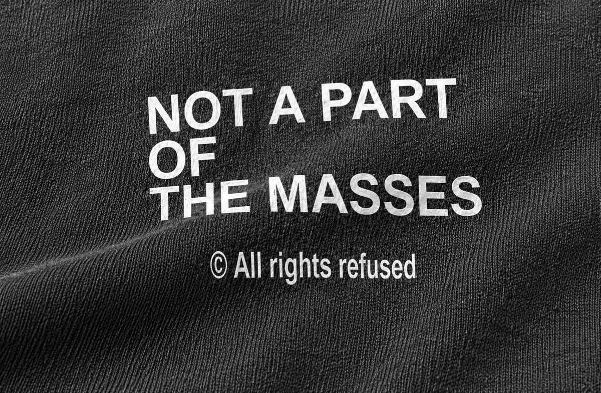 Print detail of "Not A Part Of The Masses" on The Outlier cutoff tee
