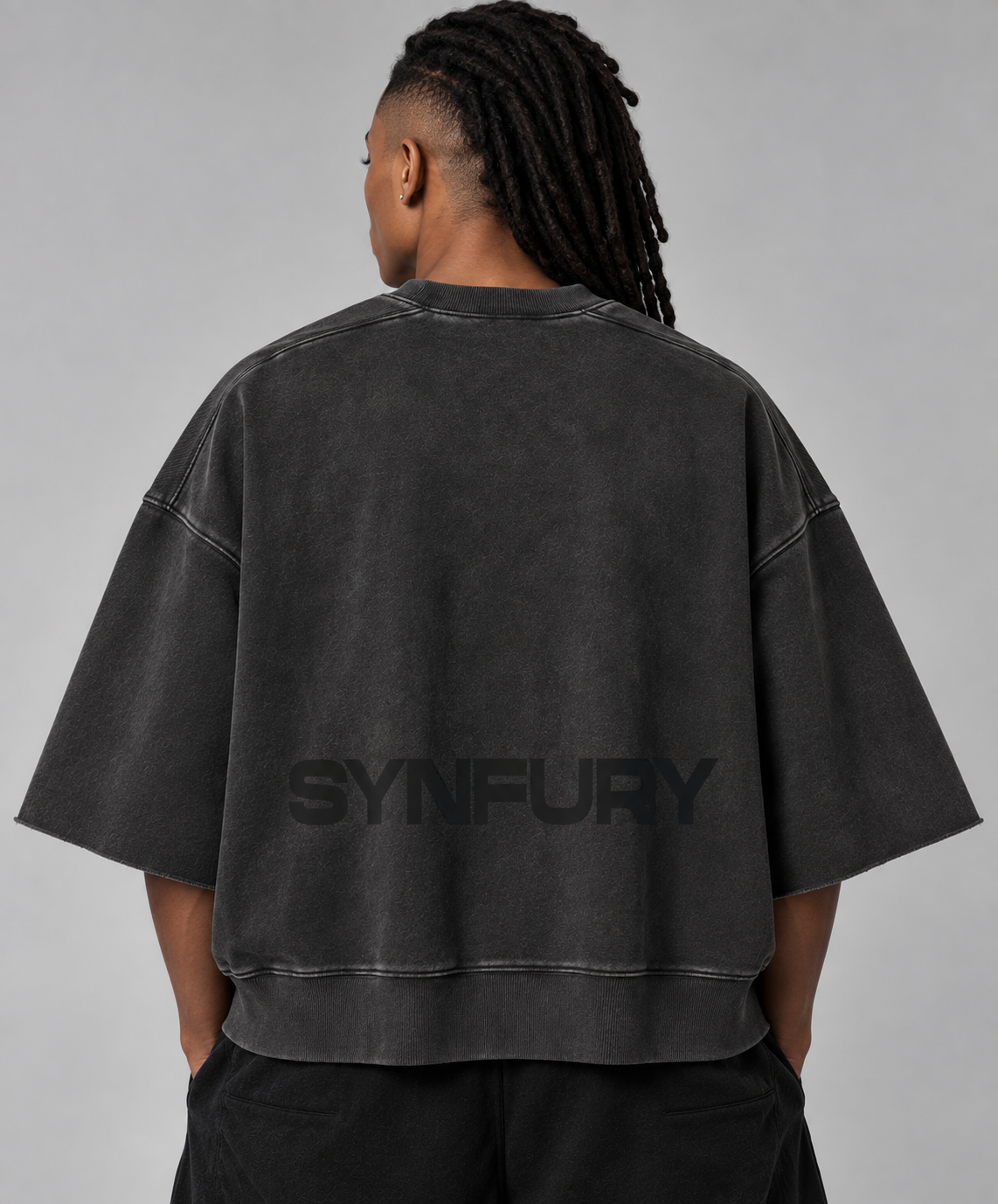 The Ribbed Crew Half Sleeve worn on model, back view — Washed Onyx heavyweight cotton, oversized boxy fit, tonal SYNFURY word mark across lower back