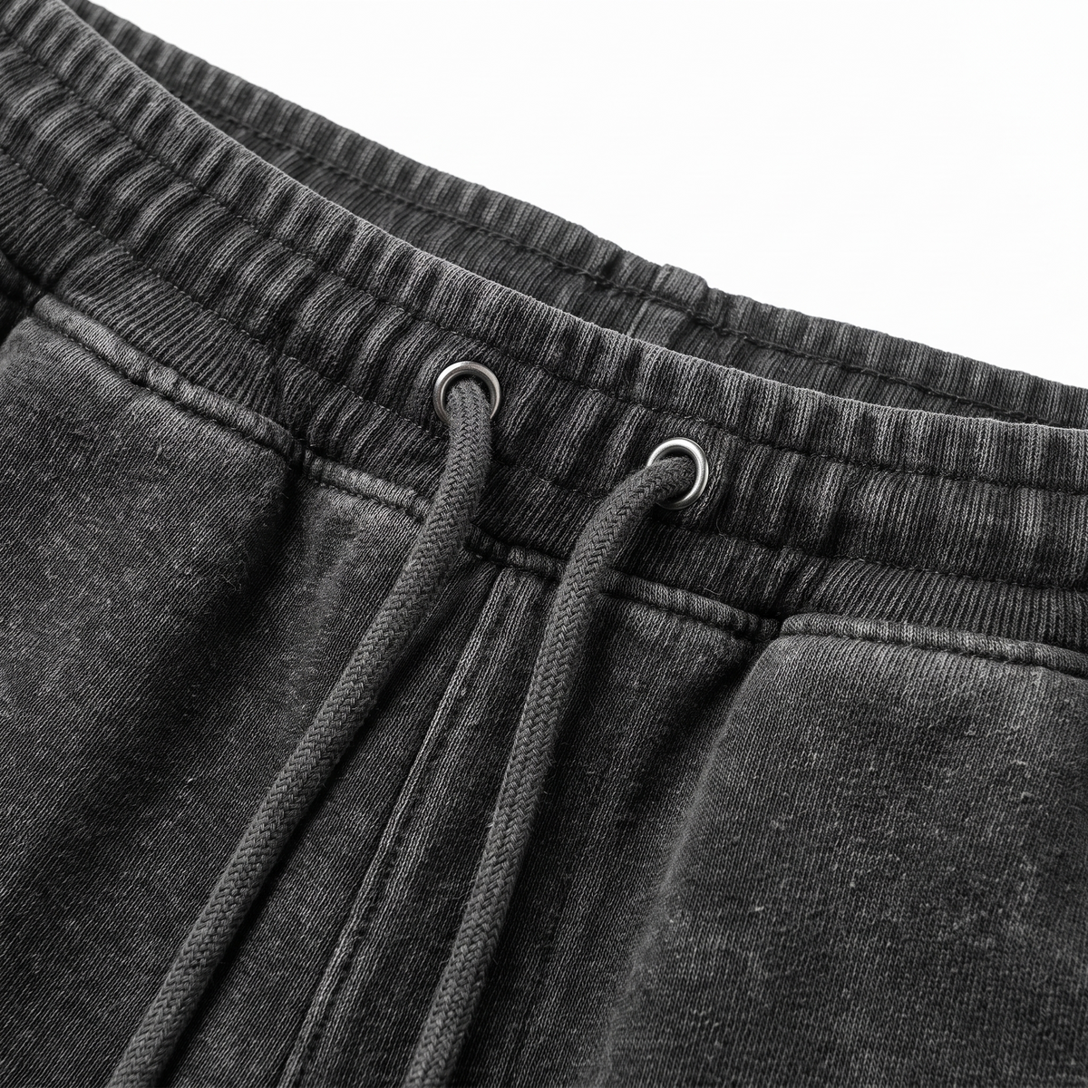 Vintage Sweatpants close-up of ribbed elastic waistband with metal grommets and drawstring detail, heavyweight cotton.