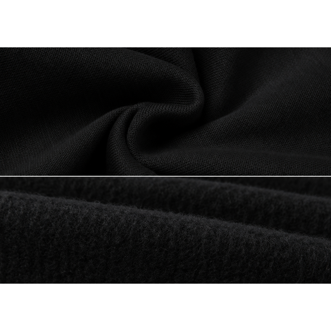 SYNFURY'S close-up of black textured fabric with a fine woven top section and a softer plush or brushed bottom section, divided by a thin white line.