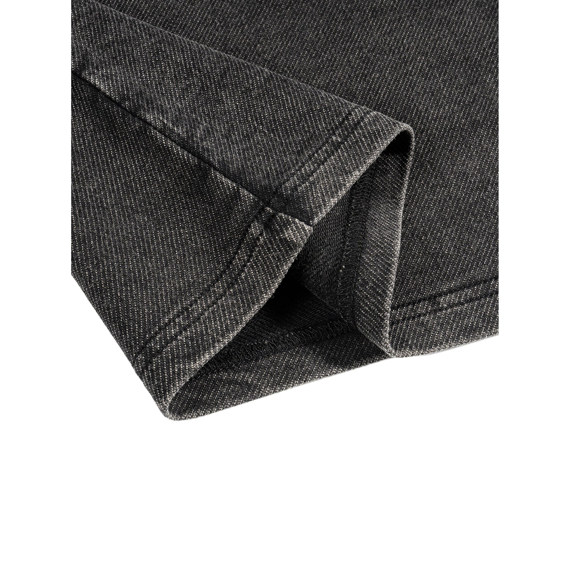 SYNFURY close-up of ash black fabric with a visible texture on a white background