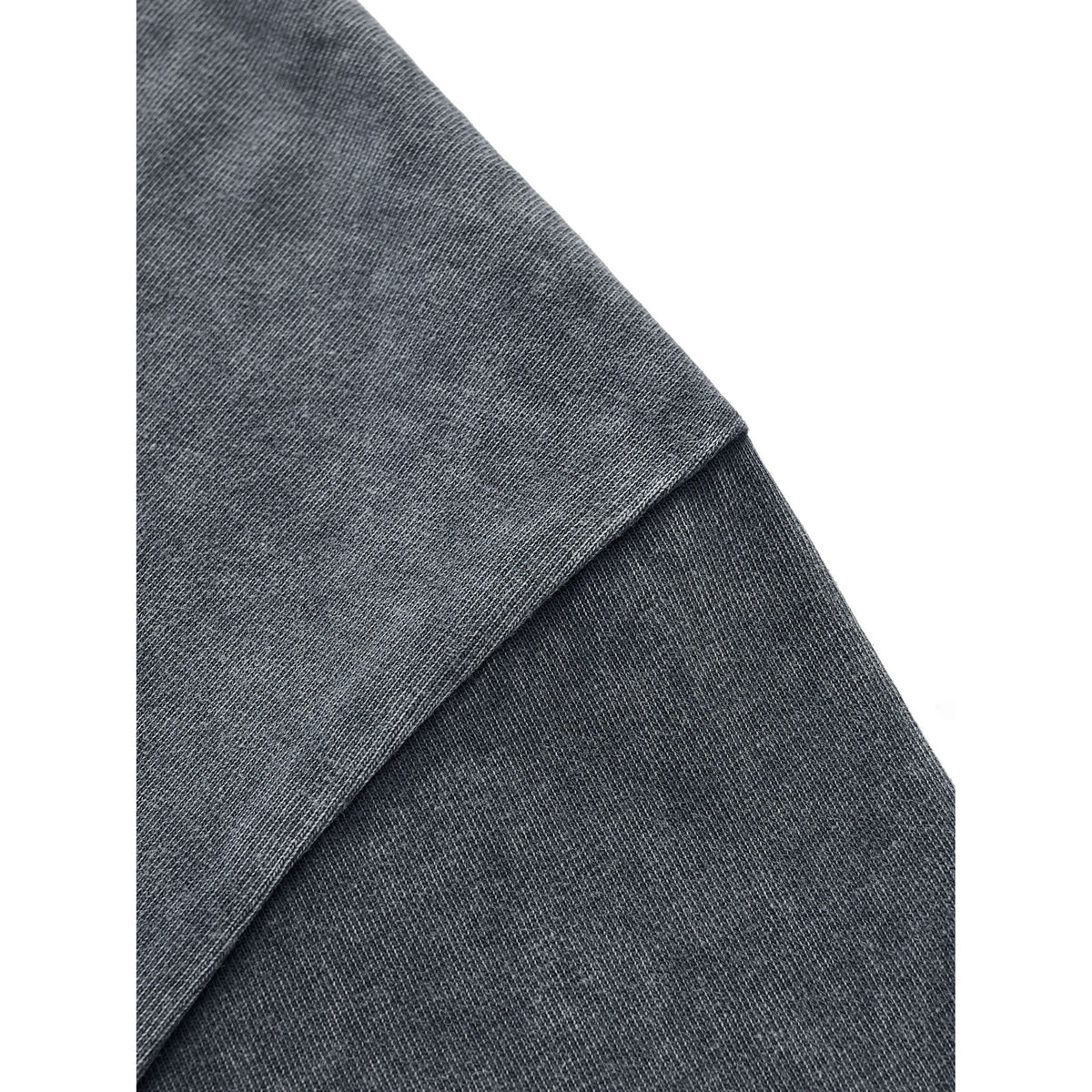 Close-up of gray fabric with a subtle pattern on a white background