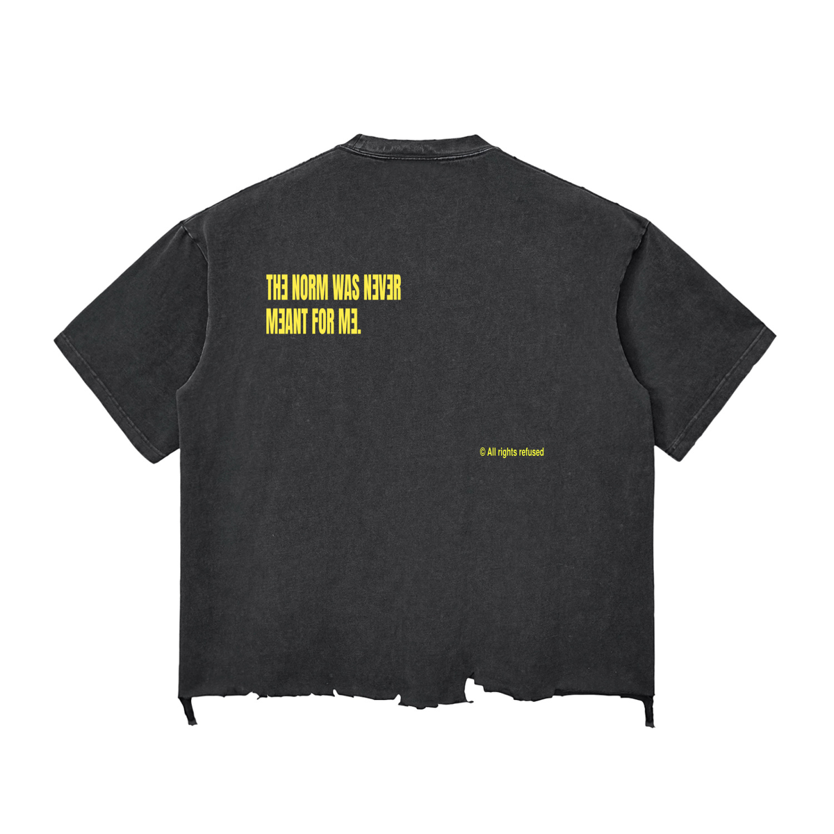 A warm charcoal black t-shirt shown from the back, featuring yellow text that reads 'THE NORM WAS NEVER MEANT FOR ME.' with a small '© all rights reserved' print below it, displayed on a solid white background.