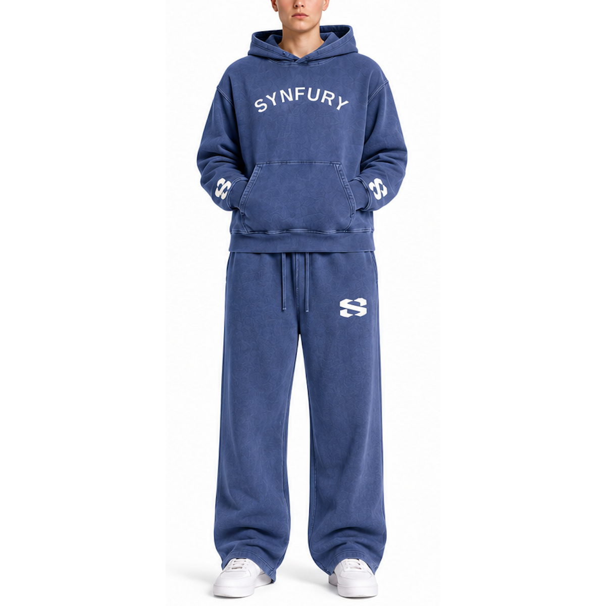 A model wearing a matching blue sweatshirt and sweatpants set with white 'SYNFURY' text on the chest and white sneakers, photographed against a plain white background.
